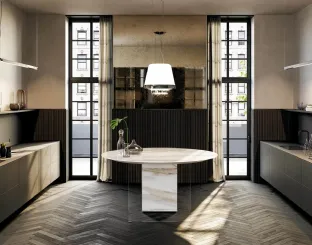 Cucina Design rotonda a isola che integra i fuochi nel piano Air Marble XGlass Calacatta Gold di Lago